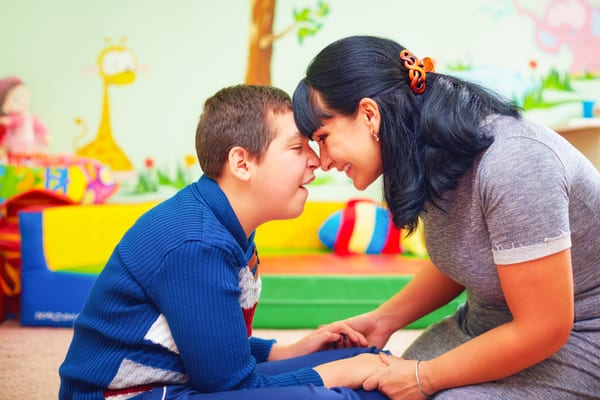 Adult and young person sharing a one-to-one moment